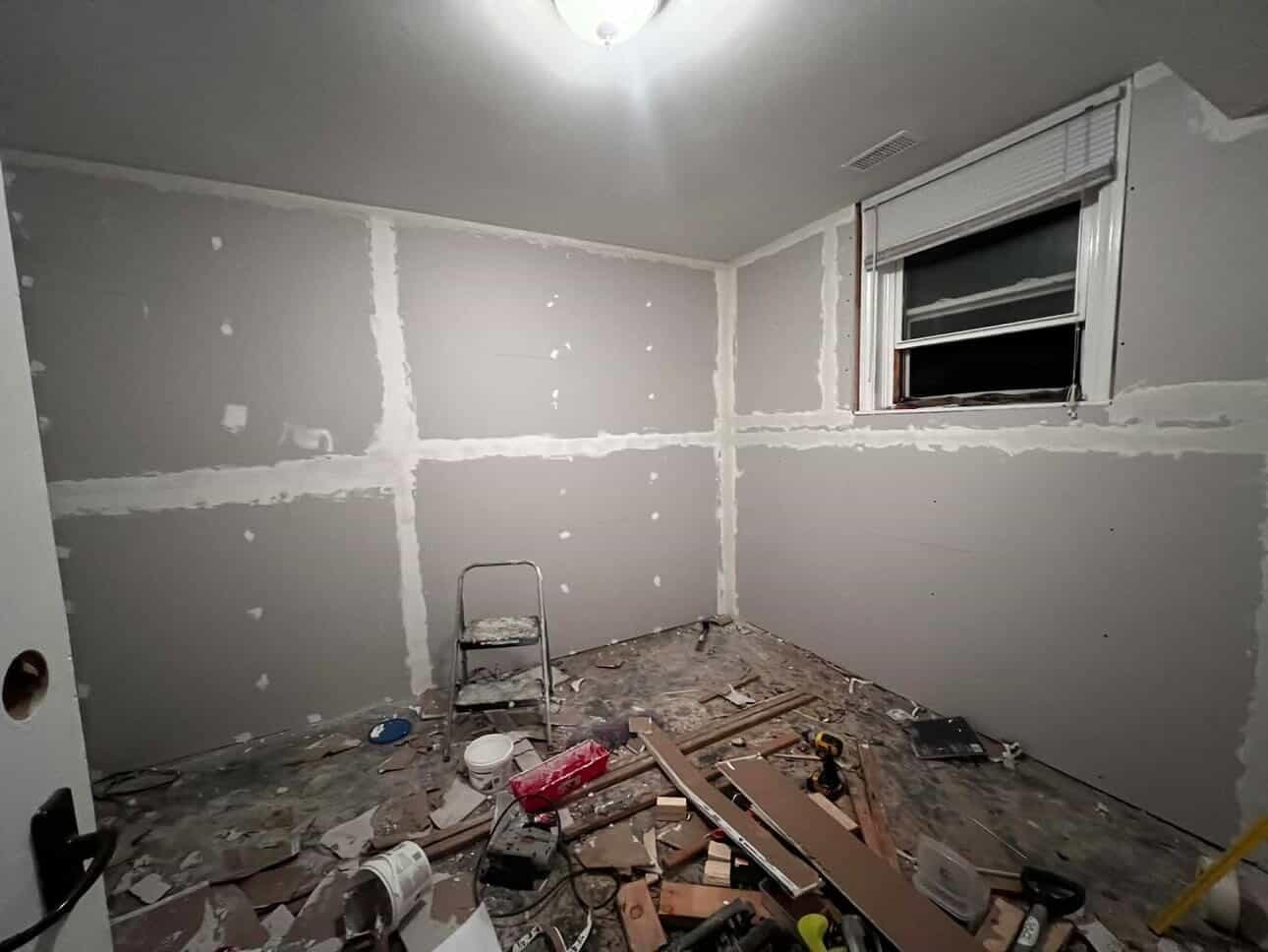 Basement room during drywall mudding phase