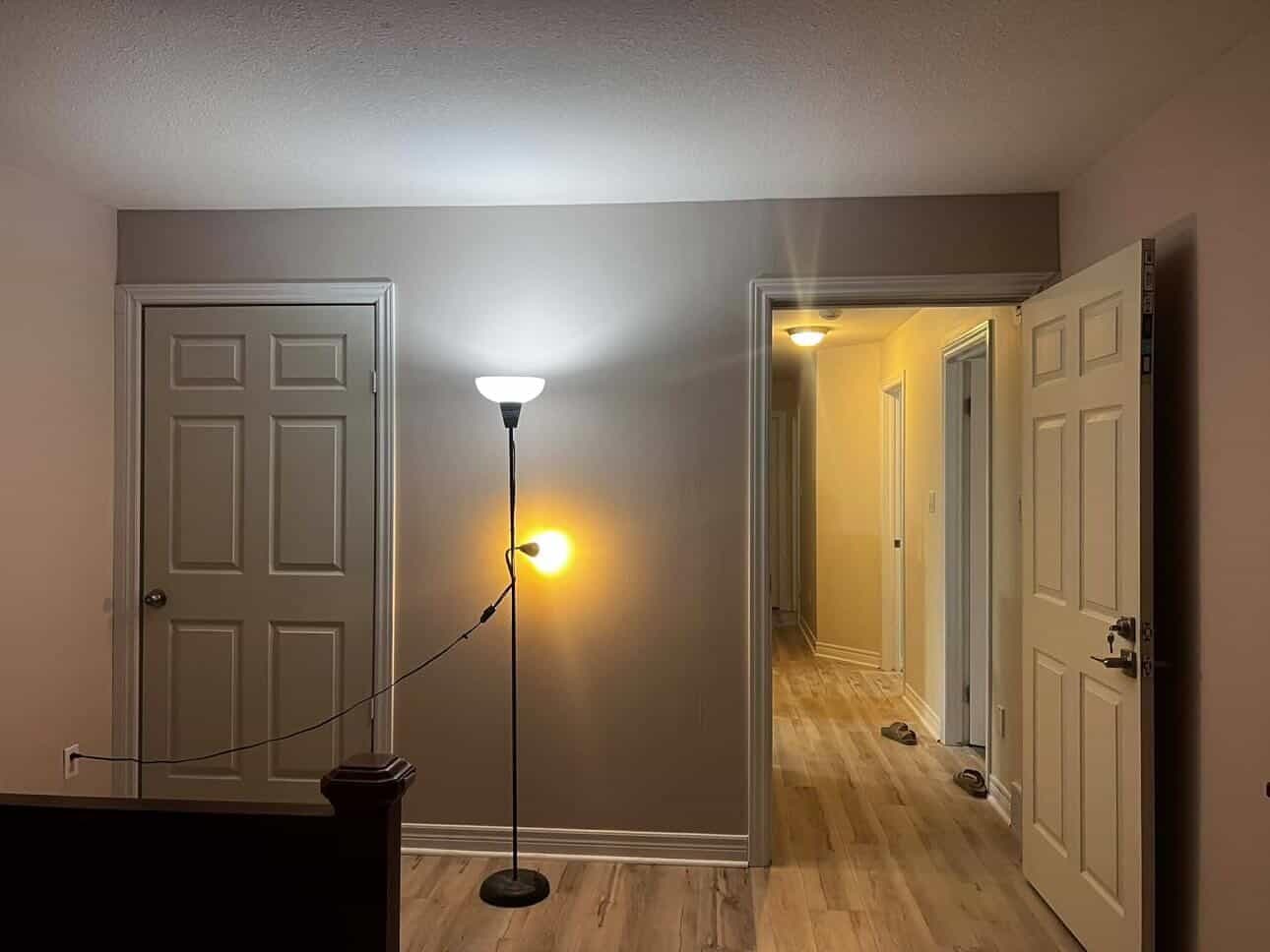 Completed room renovation with painted walls and new flooring